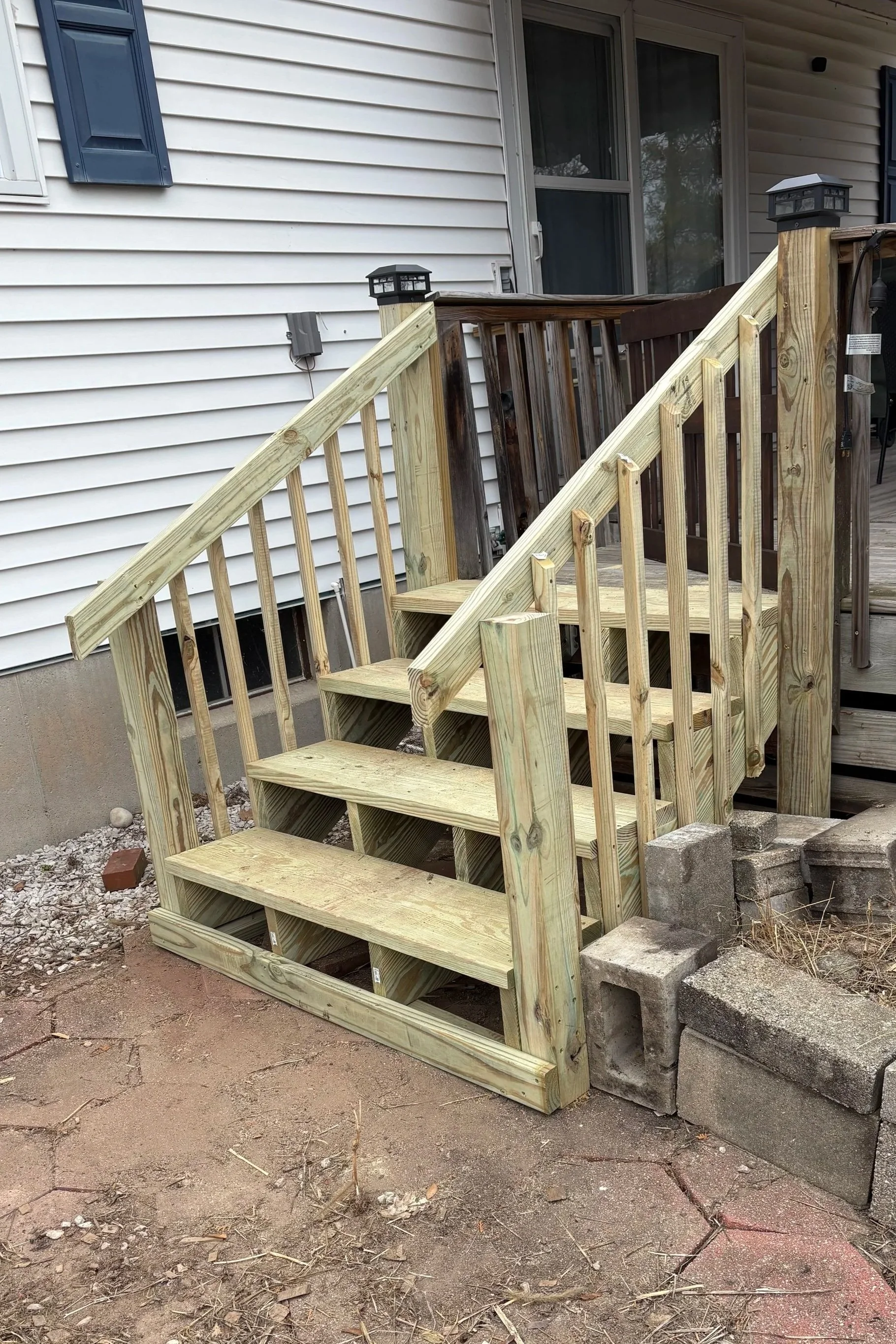 Exterior steps and railing after rebuild